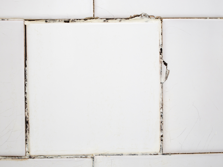 cracked shower tile damage