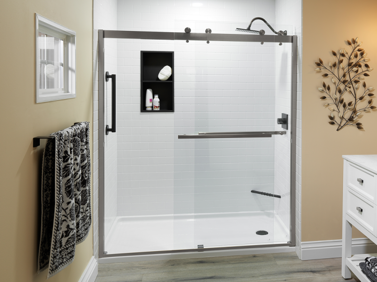 white subway sim tile walls ORB fixtures, brushed nickel cayman shower door